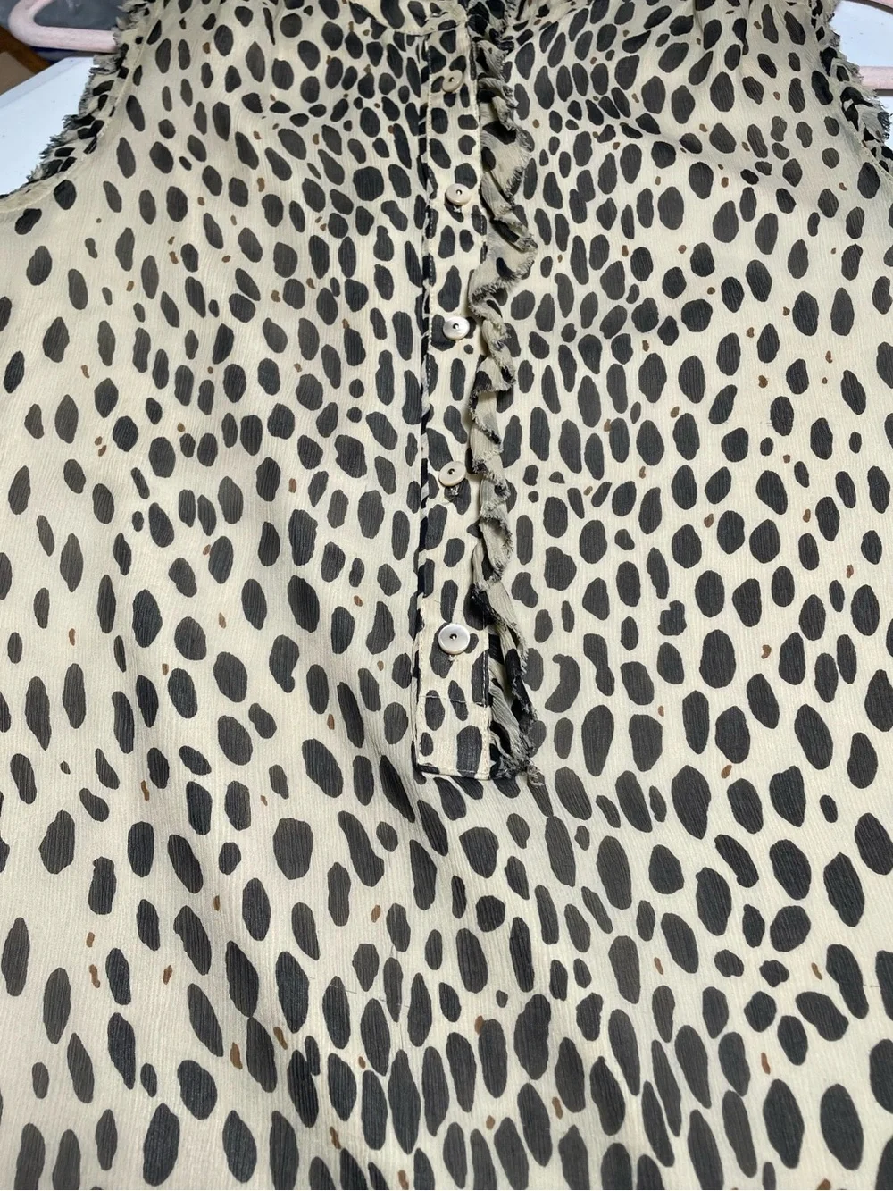 J.Crew silk blouse features a sleeveless design and a cheetah print. Size 2.